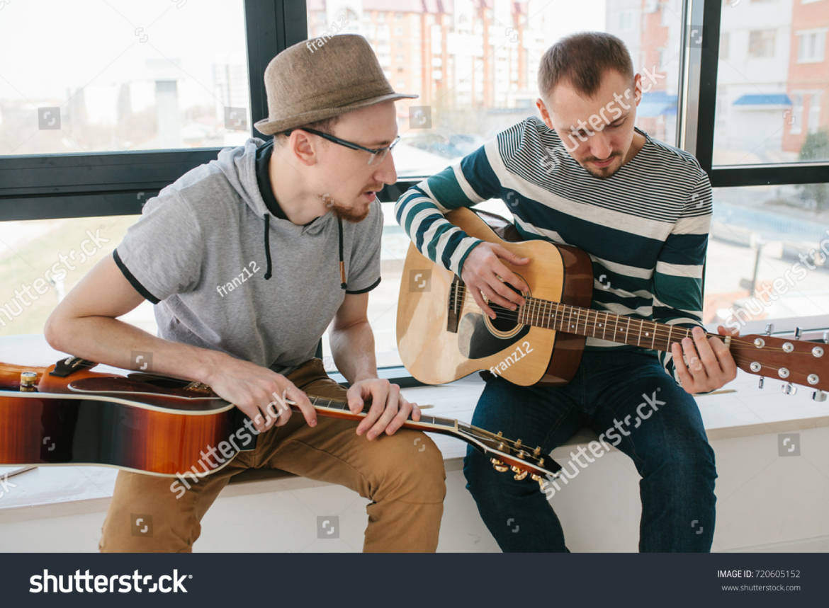 stock-photo-learning-to-play-the-guitar-music-education-720605152.jpg